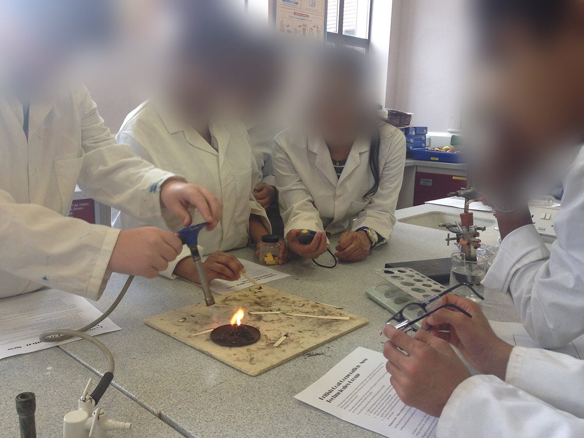 Children conducting an experiment with coal